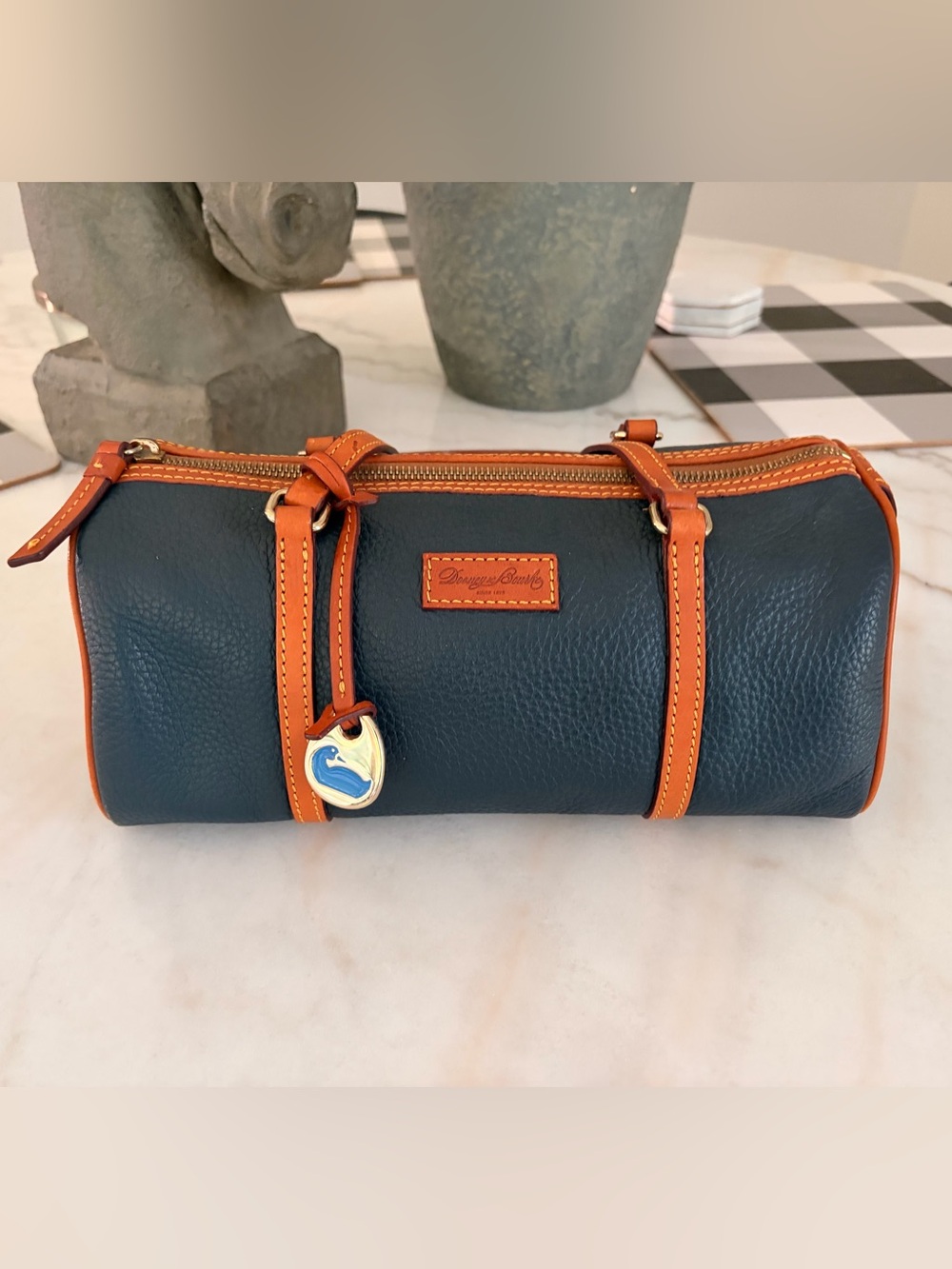 Dooney & Bourke Navy Leather Barrel Bag with Tan Trim